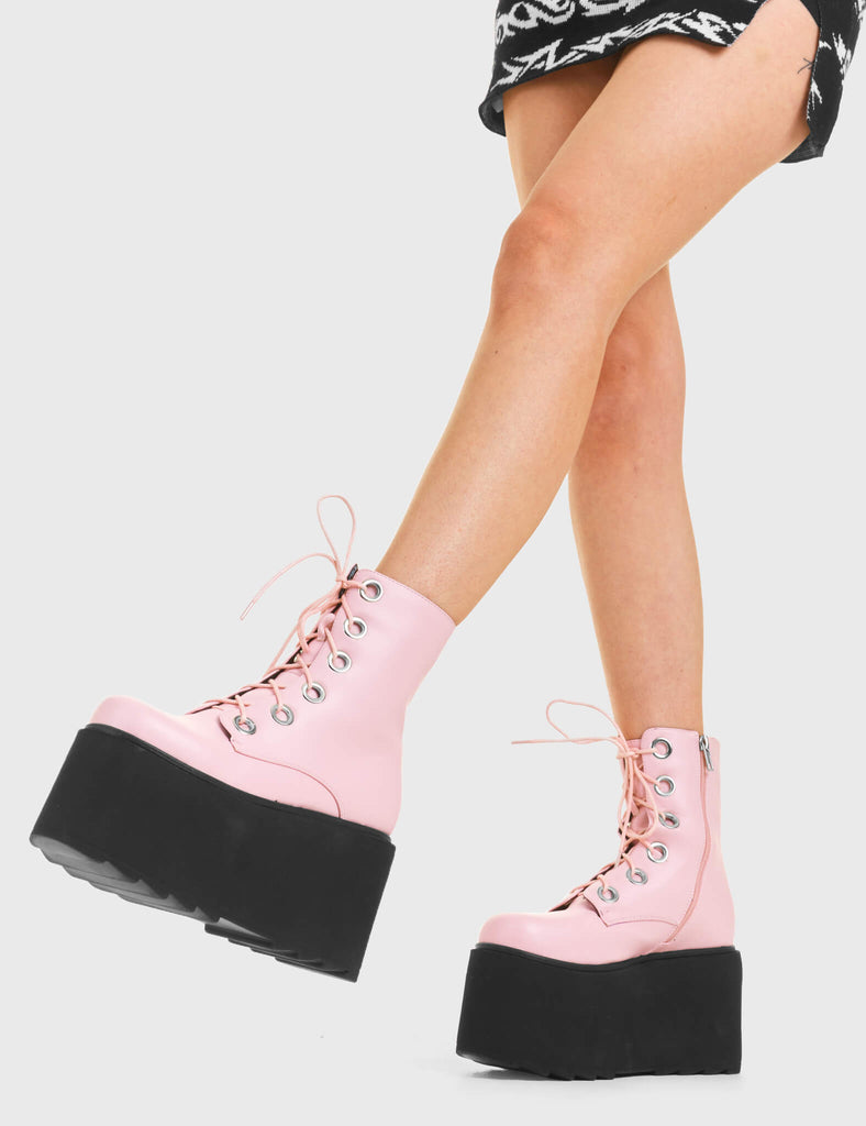 ELEVATED Renegade Chunky Platform Ankle Boots in Pink Faux Leather. These vegan western Boots feature silver eyelets and a shark teeth grip sole, very edgy. Made with eco-friendly materials and 100% cruelty-free, these boots are as ethical as they are Chic! - Chunky Platform - Ankle length - Shark teeth grip - Black Laces - Rounded toe - 100% vegan SKU: LMF 3746 - PinkPU