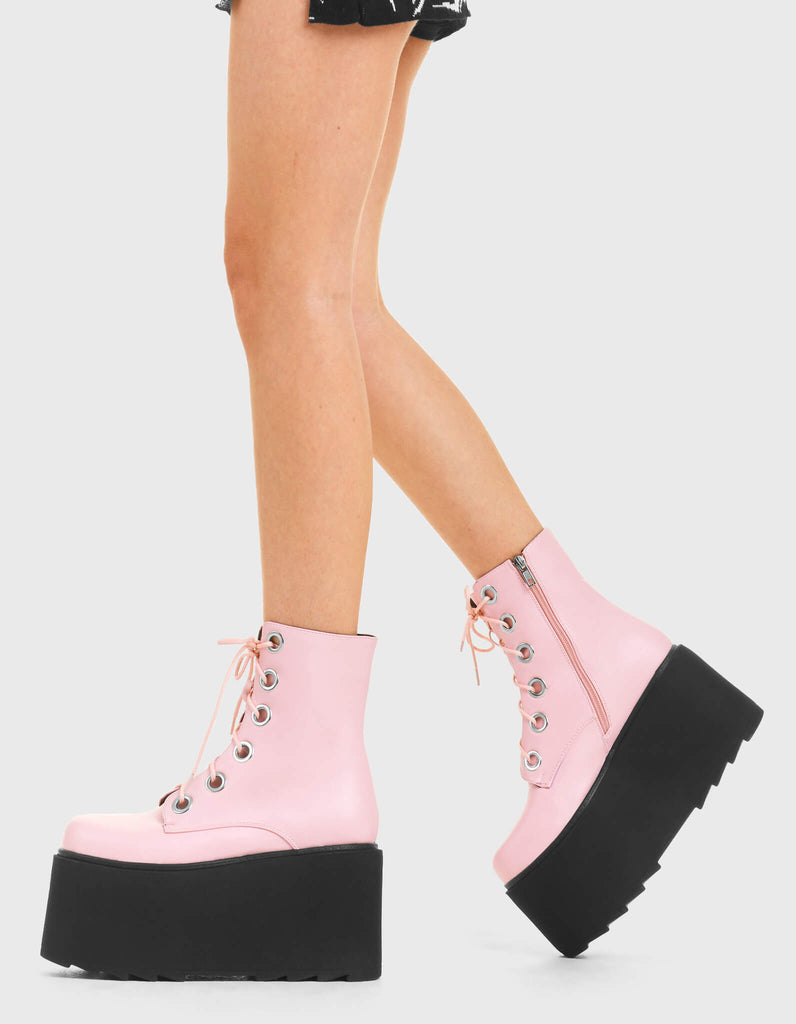 ELEVATED Renegade Chunky Platform Ankle Boots in Pink Faux Leather. These vegan western Boots feature silver eyelets and a shark teeth grip sole, very edgy. Made with eco-friendly materials and 100% cruelty-free, these boots are as ethical as they are Chic! - Chunky Platform - Ankle length - Shark teeth grip - Black Laces - Rounded toe - 100% vegan SKU: LMF 3746 - PinkPU