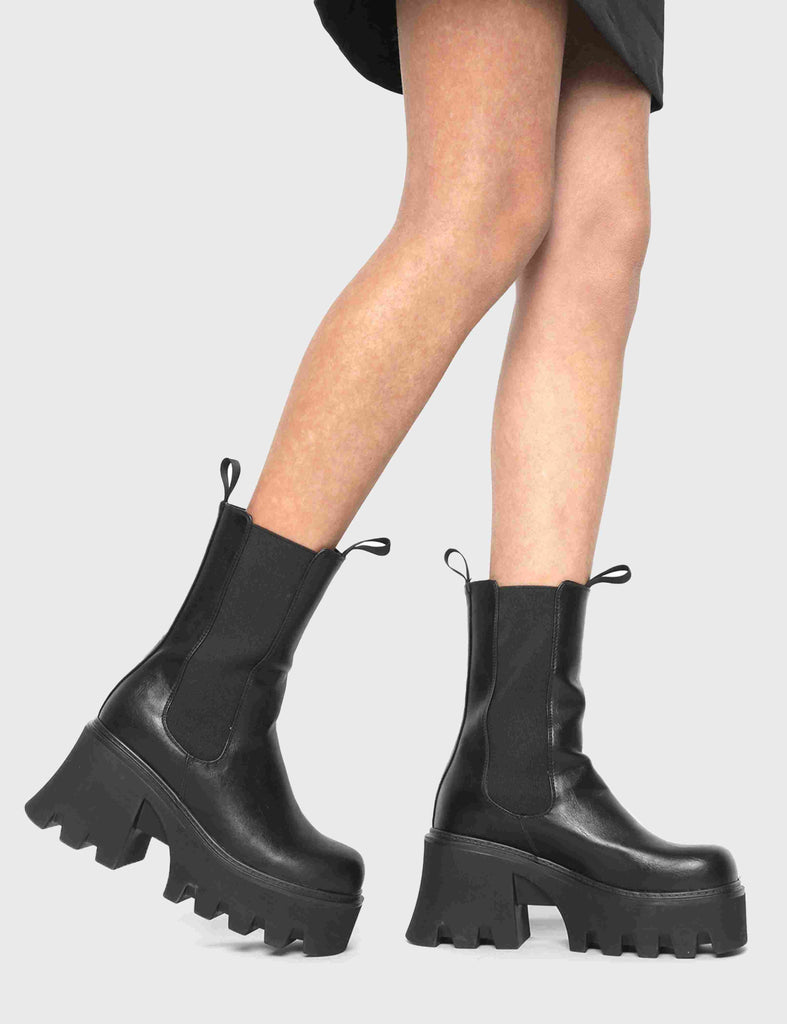COMFY AND CHUNKY Wipe Out Chunky Platform Ankle Boots in Black faux leather. These vegan Ankle Boots feature an elastic gusset and a chunky platform sole, making them the perfect comfy Boots for any occasion. Made with eco-friendly materials and 100% cruelty-free, these boots are as ethical as they are stylish! - Platform Height: 3.3 inch - Wide ankle friendly - Wide calf friendly - High ankle height - Black elastic gusset - Black pull tab - Chunky Platform sole - 100% vegan SKU: LMF 1086 - BlackPU