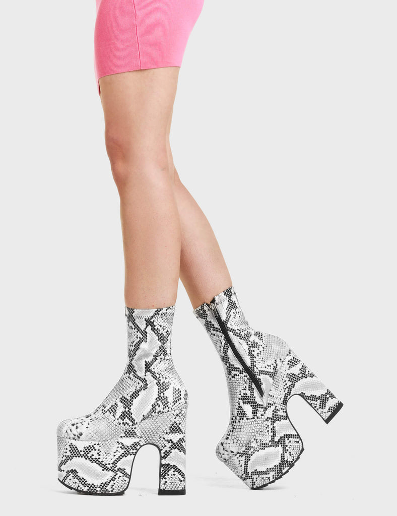 Above Snakes Chunky Platform Ankle Boots feature a unique snake pattern design.