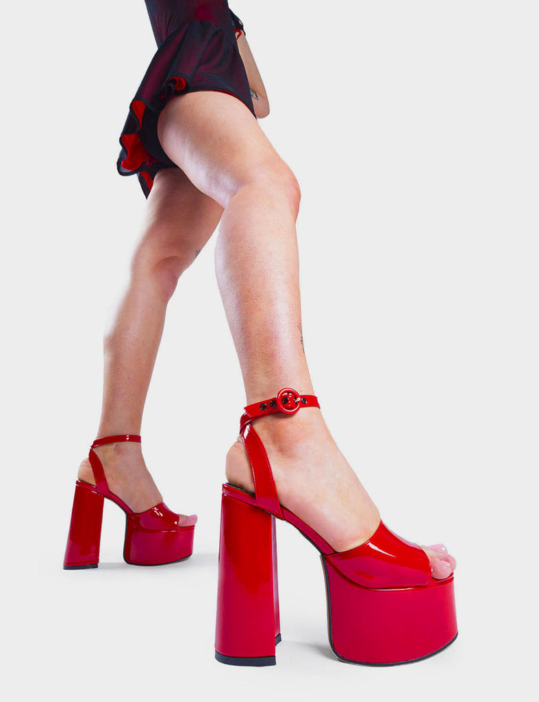MAKE YOUR STATEMENT  All For You Platform Sandals in Red Patent. These high heeled vegan Sandals feature an adjustable ankle strap with a Platform sole and high heel, perfect for adding height and glamour to any outfit. Made with eco-friendly materials and 100% cruelty-free, these Sandals are as ethical as they are hot!   - Platform Height: 2.5 inch - Heel Height: 5.5 inch - Open Toe - Wrap around ankle strap - O shaped buckle and silver eyelets - Platform sole - Round toe - 100% vegan  SKU: LMS 104 REDPAT