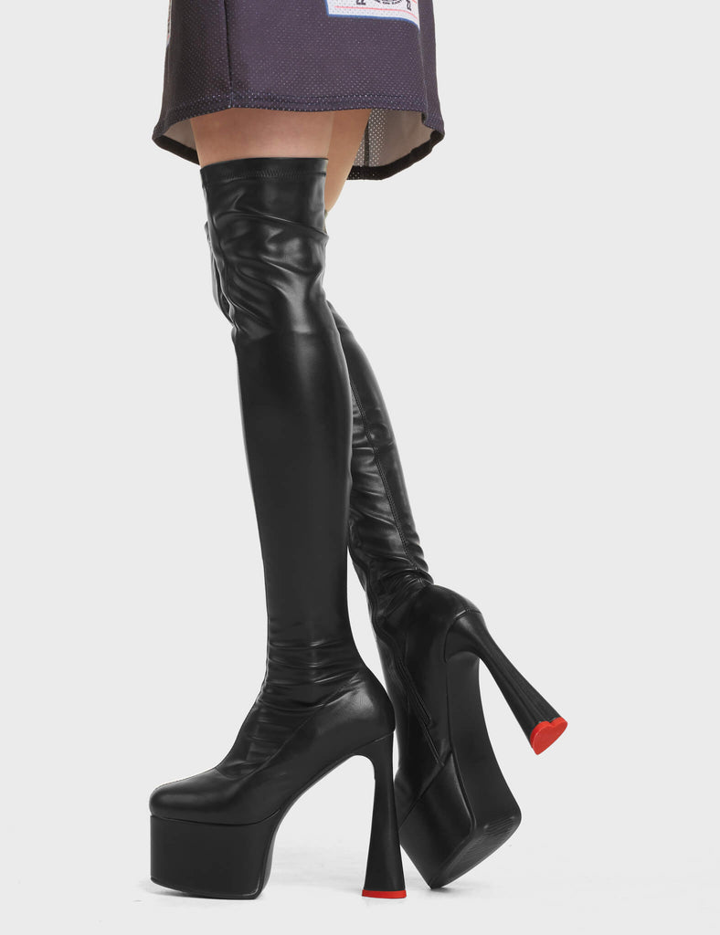 Answer Platform Thigh High Boots in black. These platform boots feature a sleek design with a fitted feel, on a platform sole and high heel.
