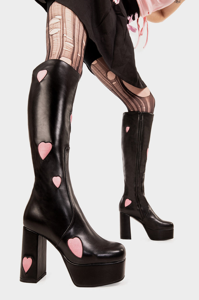 THE ONE FROM INSTA'

Candyfloss Love Platform Knee High Boots in Black faux leather. These Black vegan Boots feature our ICONIC Pink faux suede hearts and Platform sole and heel, perfect for adding height and style to any outfit. Made with eco-friendly materials and 100% cruelty-free, these boots are as ethical as they are cute!


- Platform Height: 1.25 inch
- Heel Height: 4.2 inch
- Knee High length
- Pink Hearts
- Black zipper 
- Platform sole
- Round Toe
- 100% vegan 

SKU: LMF 0915 - Black/PinkHeart