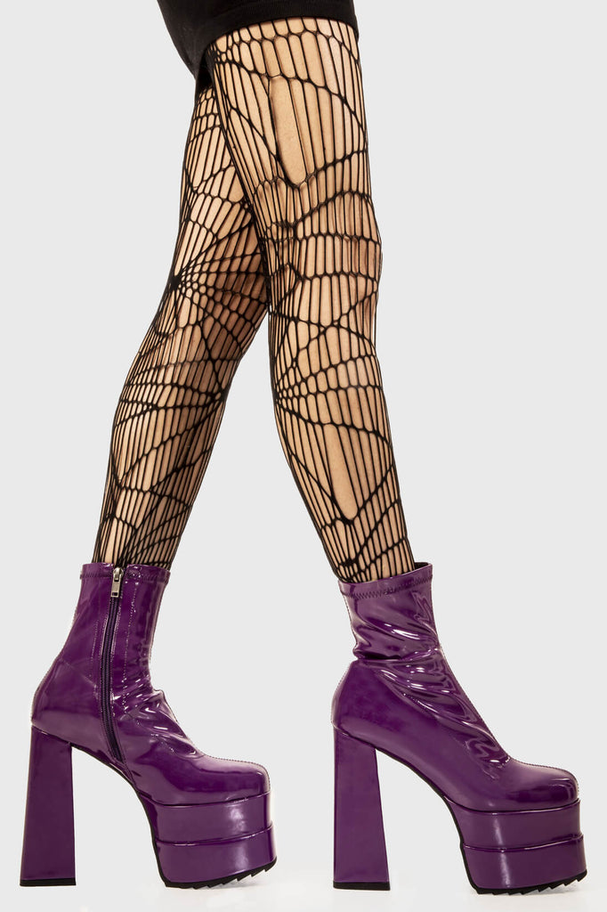 Runway Ready
  
 Cassette Platform Ankle Boots in Purple Patent faux leather. These purple vegan Platform boots feature on our double stack platform sole, sleek and stylish to own your runway! Made with eco-friendly materials and 100% cruelty-free, these platform boots are as ethical as they are runway worthy!
 
 
 - Platform Height
 - Heel Height
 - Purple Zipper 
 - Shark's teeth rubber grip 
 - Chunky platform sole
 - Square Toe
 - 100% vegan 
 
 SKU: LMF 2141 - PurplePAT