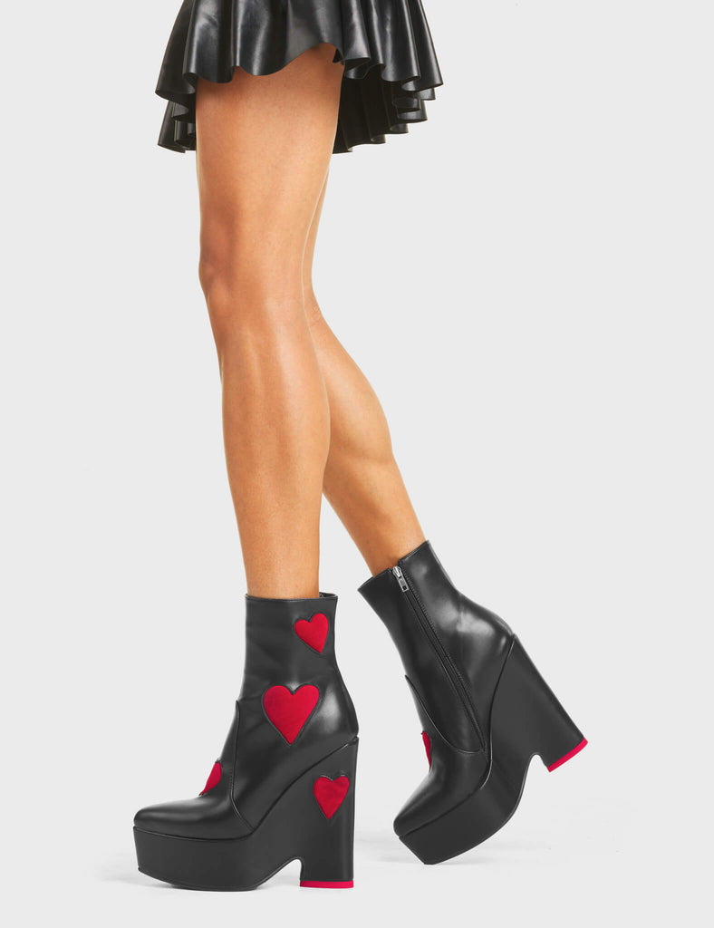 DARK LOVE

Copacetic Chunky Platform Ankle Boots in Black faux leather. These platform boots feature big dark red hearts with a platformed wedge. Also features a red heart on the heel. Made with eco-friendly materials and 100% cruelty-free, these platform boots are as ethical as they are chic.

- Platform Height
- Ankle Length
- Dark Red hearts
- Rounded Toe
- High Heel
- 100% Vegan

SKU: LMF 5237 - BlackPU/DarkRed