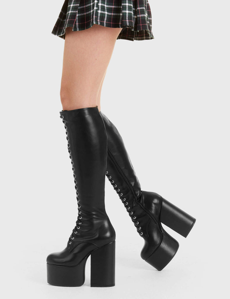 Sky High!
 
 Everest Platform Knee High Bootsin Black faux leather. These black platform boots feature adjustable black lace up detail with silver eyelets, reach new levels to your fashion. Made with eco-friendly materials and 100% cruelty-free, these platform boots are as ethical as they are platform perfection!
 
 - Platform Height
 - Heel Height
 - Knee high lengh
 - Black Zipper
 - Black laces with silver eyelets
 - High Platform sole
 - Round Toe 
 - 100% vegan 
 
 SKU: