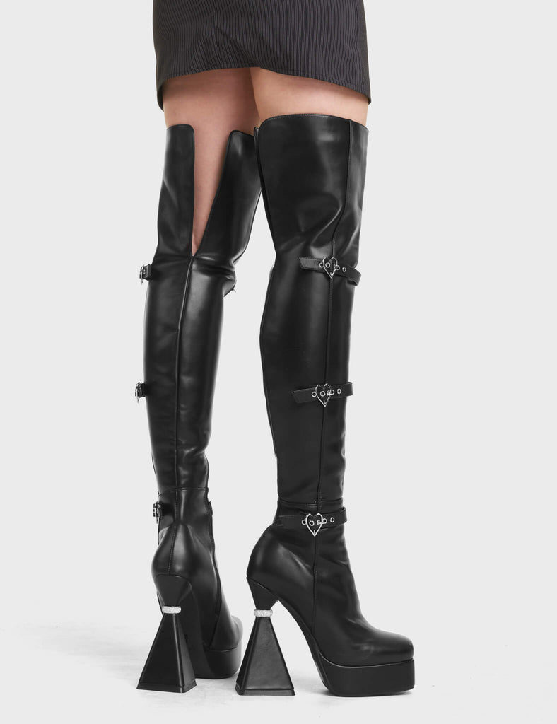 Fantasy Platform Thigh High Boots in Black. Feature heart shaped buckles, on a platform sole with silver ring platform heel.