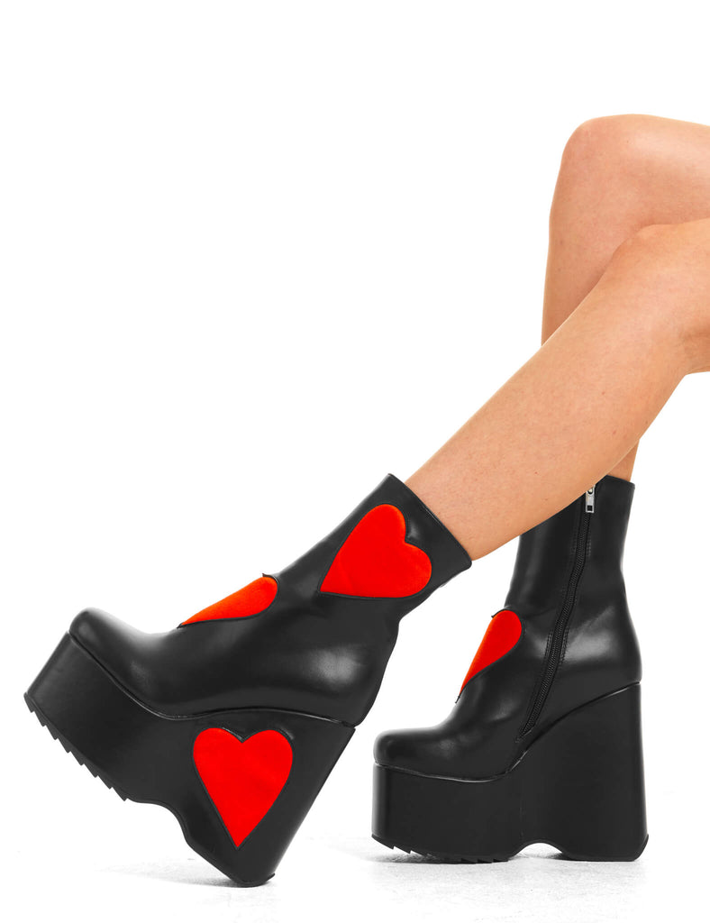 IT'S ALL ABOUT LOVE
 
 Full Time Lover Chunky Platform Ankle Boots in Black faux leather. These platform boots feature big red hearts with a platformed wedge. Made with eco-friendly materials and 100% cruelty-free, these platform boots are as ethical as they are chic.
 
 - Platform Height
 - Ankle length
 - Red hearts
 - Rounded toe
 - High Heel
 - 100% vegan 
 
 SKU: LMF 3538 - BlackPU/RedHeart