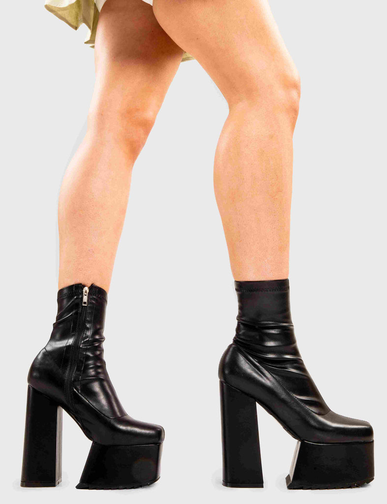 Not Your Basic Boots

Get Out Platform Ankle Boots in Black faux leather. These platform boots feature a minimalist design, with a stretchy fitted feel, the perfect pair with any outfit. Made with eco-friendly materials and 100% cruelty-free, these platform boots are as ethical as they are Cool!

- Platform Height
- Heel Height
- Fitted feel
- Black Zipper
- Ankle length
- Platform sole
- Shark's teeth grip
- High Heel
- 100% vegan 

SKU: LMF 2857 - BlackPU