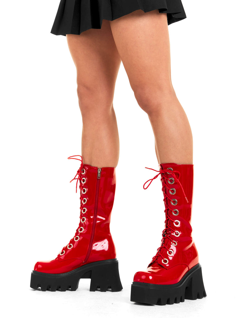 THESE BOOTS ARE MADE FOR WALKING
 
 Get Paid Chunky Platform Calf Boots in Red patent. These vegan western Boots feature a black lace up boot with silver round eyelets , very classy. Made with eco-friendly materials and 100% cruelty-free, these boots are as ethical as they are edgy!
 
  
 - Chunky Platform
 - Calf length
 - Lace up
 - Silver round eyelets
 - Rounded toe 
 - 100% vegan 
 
 SKU: LMF 3605 - RedPAT