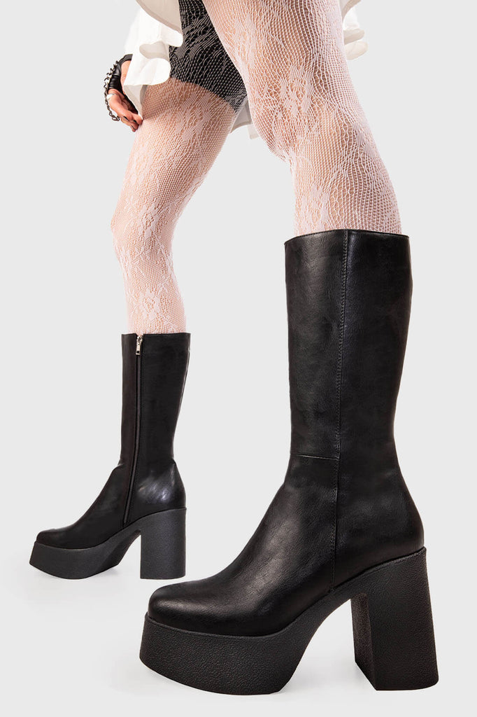 Ain't no holla back girl 
 
 Holler Back Platform Calf Boots in black faux leather. These black vegan Boots feature on our rubber platform sole, will make them come crawling back. Made with eco-friendly materials and 100% cruelty-free, these boots are as ethical as they are independent!
 
 
 - Platform Height: 1.25 inch
 - Heel Height: 4 inch
 - Calf High length
 - Black zipper 
 - Platform sole
 - Sqaure Toe
 - 100% vegan 
 
 SKU: LMF 1215 - BlackPU