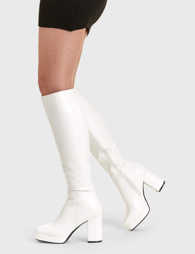 Elegant Entrancers
 
 Humble Platform Knee High Boots in White faux leather. These white Platform Boots feature on our platform sole with gusset detail to the back of the boot, perfect for any occasion. Made with eco-friendly materials and 100% cruelty-free, these platform boots are as ethical as they are Elegant! 
 
 - Platform Height
 - Heel Height
 - Gusset detail
 - Black zip
 - Wide ankle and calf friendly
 - Platform sole
 - Square Toe 
 - 100% vegan 
 
 SKU: LMF 2179 - White