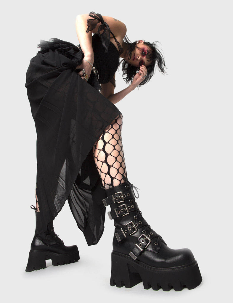 MAKE YOUR STATEMENT
 
 Hysteria Chunky Platform Ankle Boots in Black faux leather. These Platform Ankle Boots feature Silver buckles on a Chunky and comfortable Platform sole, making them the perfect choise to dress up any outfit! Made with eco-friendly materials and 100% cruelty-free.
 
 
 - Platform Height: 3.3 inch
 - High ankle height
 - Square buckles and silver eyelets
 - Chunky Platform sole
 - Lace up
 - Black zipper
 - Square toe 
 - 100% vegan 
 
 SKU: LMF 1091 - BlackPU