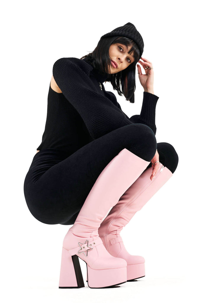 KEEPING IN CUTE
 
 I'm Your Star Platform Knee High Boots in Pink faux leather. These platform boots feature a minimalist look with a silver star buckle. Made with eco-friendly materials and 100% cruelty-free, these platform boots are as ethical as they are chic.
 
 - Platform Height
 - Knee high 
 - Silver star buckle
 - Flared heel
 - High Heel
 - 100% vegan 
 
 SKU: LMF 3359 - PinkPU