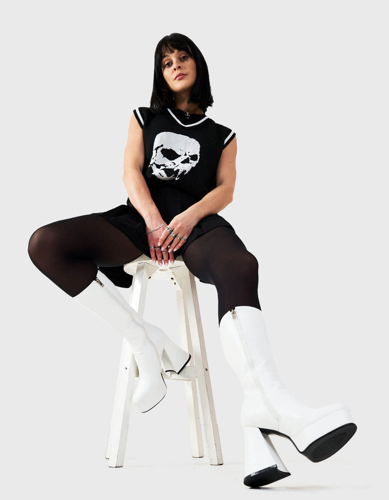 Obsessed  Infatuation Platform Calf Boots in White faux leather. These white vegan Platform Boots feature on our platform sole, walking on platform dreams.Made with eco-friendly materials and 100% cruelty-free, these platform boots are as ethical as they are sexy.   - Platform Height: 2.6 inch - Heel Height: 5.5 inch - Calf High length - White Zipper - Platform sole - Flared heel - Round Toe - 100% vegan  SKU: LMF 1869 - White PU