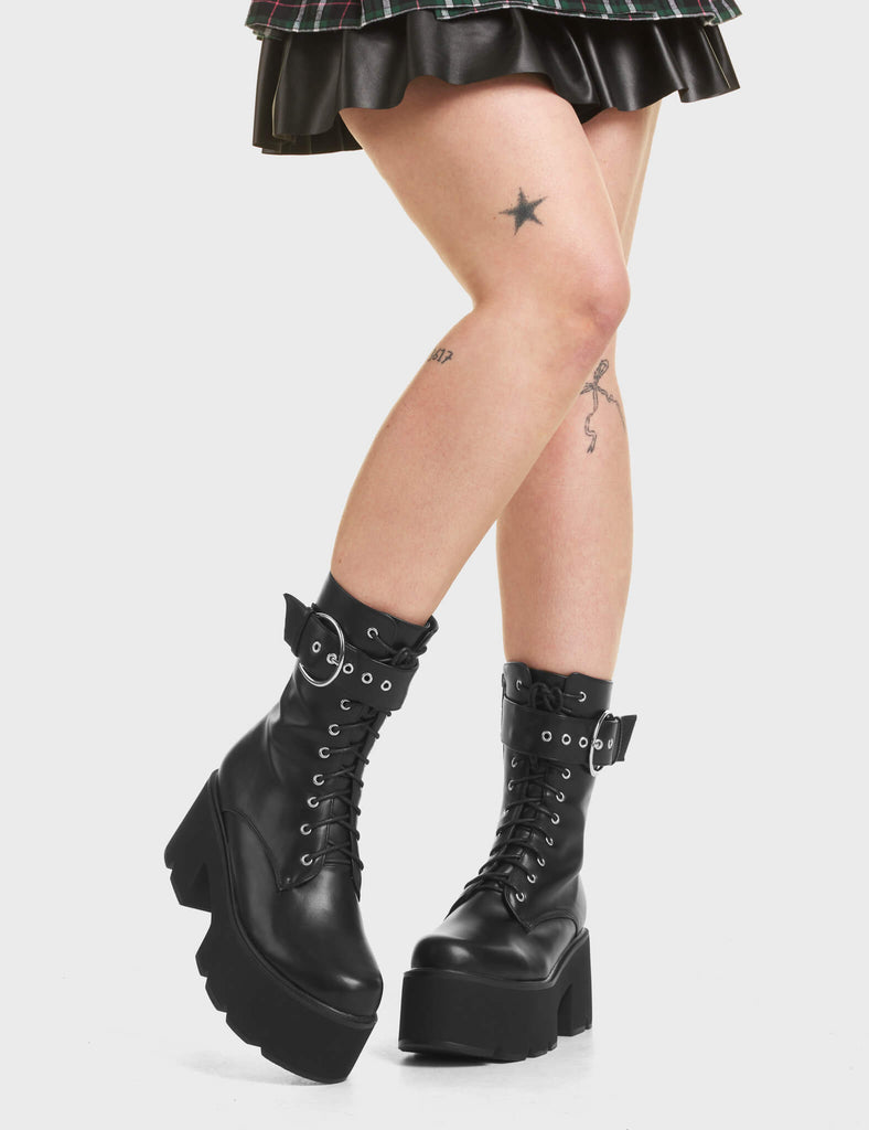 Injustice Chunky Platform Ankle Boots in Black. Featuring a lace-up design.