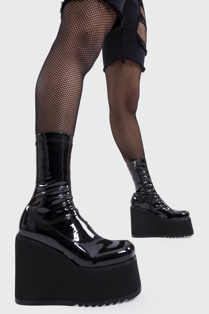 Platform Staples
 
 Lights Out Chunky Platform Ankle Boots in Black Patent faux leather. These black platform boots feature on our chunky platform wedge sole, step up your shoes game! Made with eco-friendly materials and 100% cruelty-free, these platform boots are as ethical as they are Fashion Staples!
 
 - Platform Height
 - Black Zip
 - Chunky Platform wege sole
 - Shark's teeth rubber grip
 - Round Toe 
 - 100% vegan 
 
 SKU: LMF 2369 - BlackPAT