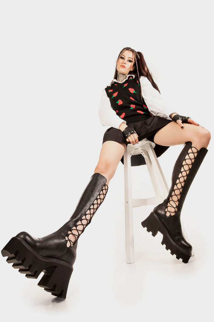 OUT ON THE TOWN 
 
 MIsery Business Chunky Platform Knee High Boots in Black faux leather. These Black vegan Knee High Boots feature an lace gusset design and a CHUNKY Platform sole, perfect for adding height and style to any outfit. Made with eco-friendly materials and 100% cruelty-free, these boots are as ethical as they are cute!
 
 
 - Platform Height: 3.3 inch
 - Knee High length
 - Black zipper 
 - Chunky Platform sole
 - Lace elastic gusset
 - Square toe 
 - 100% vegan 
 
 SKU: LMF 1247 - BlackPU