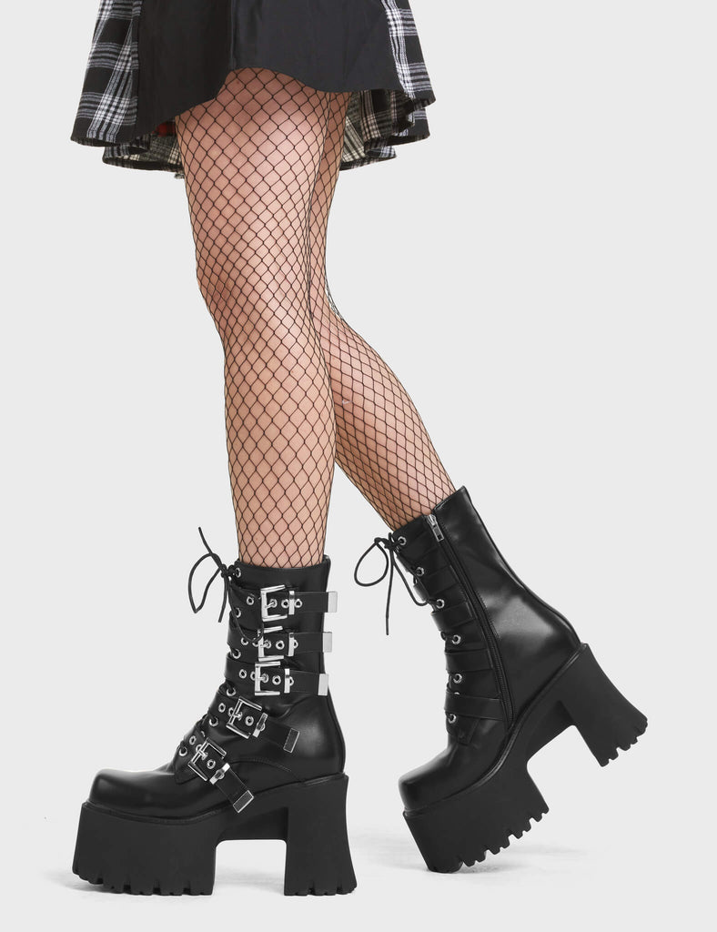 Me Likey Chunky Platform Ankle Boots in Black. These chunky ankle boots feature silver buckles with adjustable straps.
