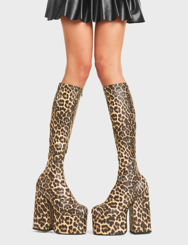 Messenger Platform Knee High Boots in Brown Leopard print. Feature a minimalist design, platform sole and a stretch fit.