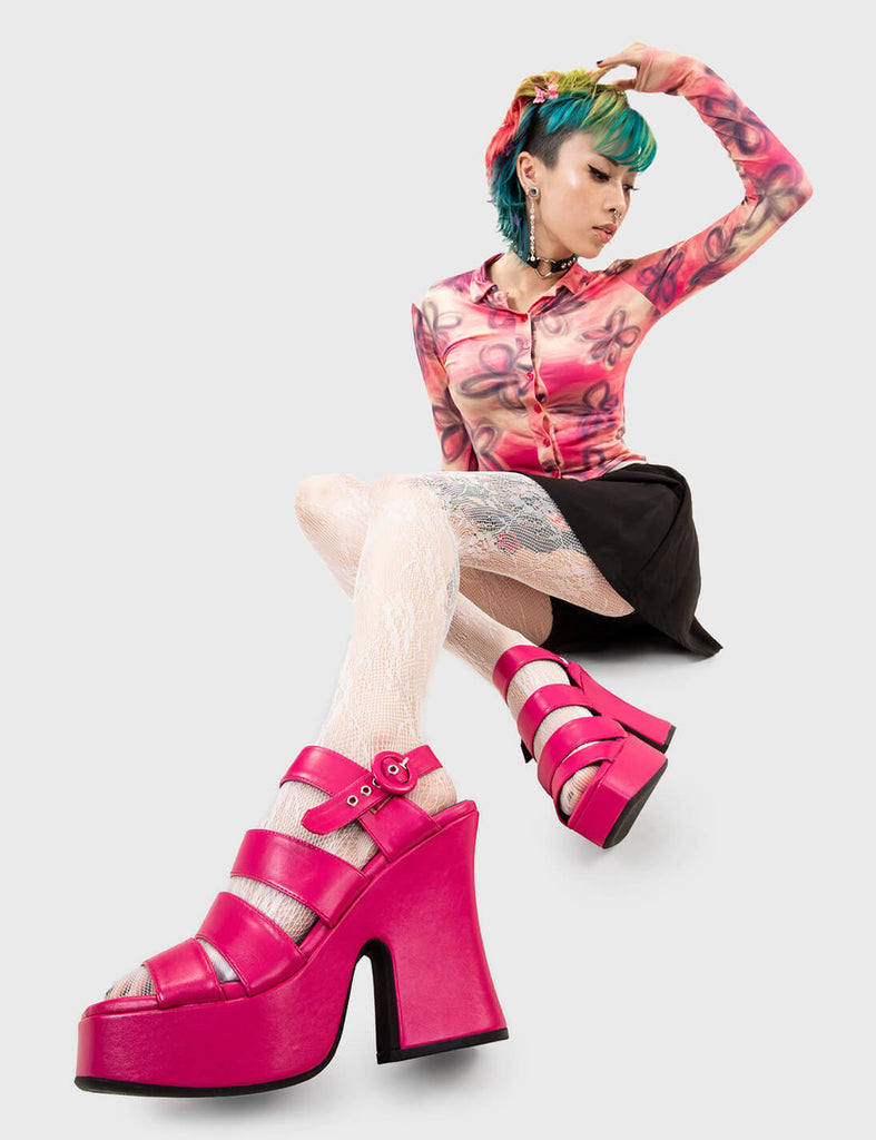Holiday Mode
 
 Not A Friend Platform Sandals in Fuchsia faux leather. These platform sandals feature three straps across the upper with a adjustable strap across the heel, step into relaxation and comfort. Made with eco-friendly materials and 100% cruelty-free, these platform boots are as ethical as they are COMFORTABLE!
 
 - Platform Height
 - Heel Height
 - Adjustable strap
 - Silver eyelets with 'O'shaped buckle
 - Chunky Platform sole
 - Round Toe 
 - 100% vegan 
 
 SKU: LMF 2510 - FuchsiaPU