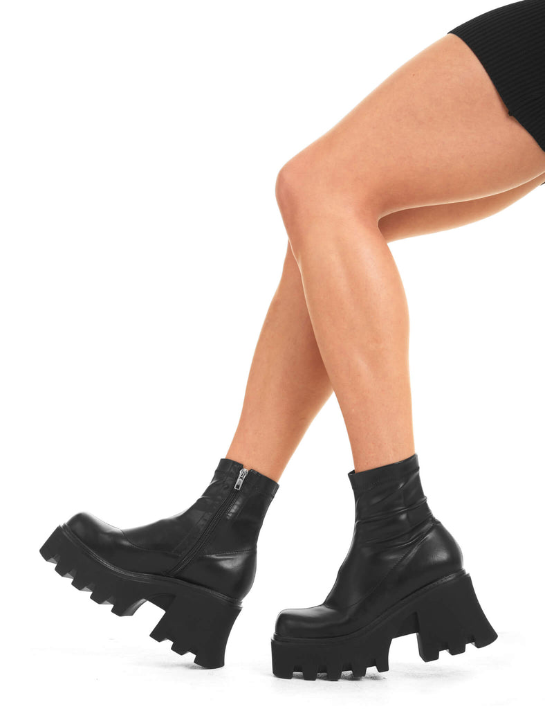 UPGRADE YOUR STYLE
 
 Notorious Chunky Platform Ankle Boots in Black fitted faux leather. These vegan western Boots feature a minimalist look with chunky soles, very classy. Made with eco-friendly materials and 100% cruelty-free, these boots are as ethical as they are edgy!
 
  
 - Chunky Platform
 - Ankle length
 - Rounded toe 
 - 100% vegan 
 
 SKU: LMF 3601 - LMF 3601 - BlackStretchPU