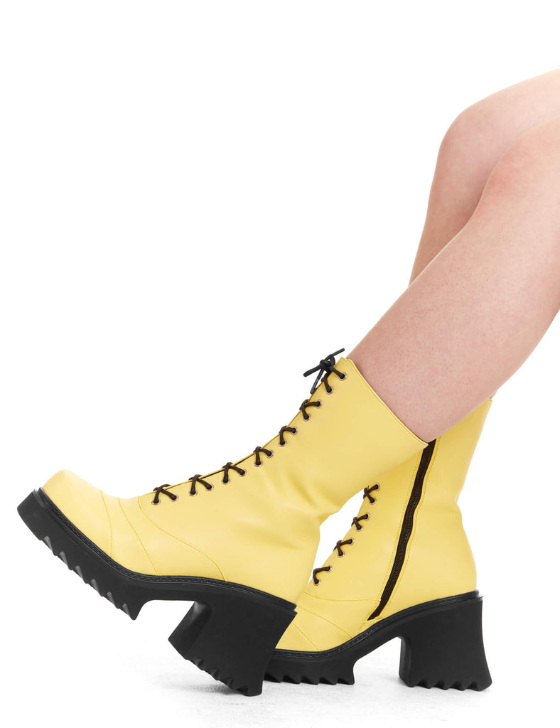 LACED UP
 
 On A Buzz Chunky Platform Ankle Boots in yellow faux leather. These vegan western Boots feature black laces and a shark teeth grip sole, very chic. Made with eco-friendly materials and 100% cruelty-free, these boots are as ethical as they are edgy!
 
  
 - Chunky Platform
 - Calf length
 - Shark teeth grip
 - Black laces
 - Rounded toe 
 - 100% vegan 
 
 SKU: LMF 3730 - LemonPU