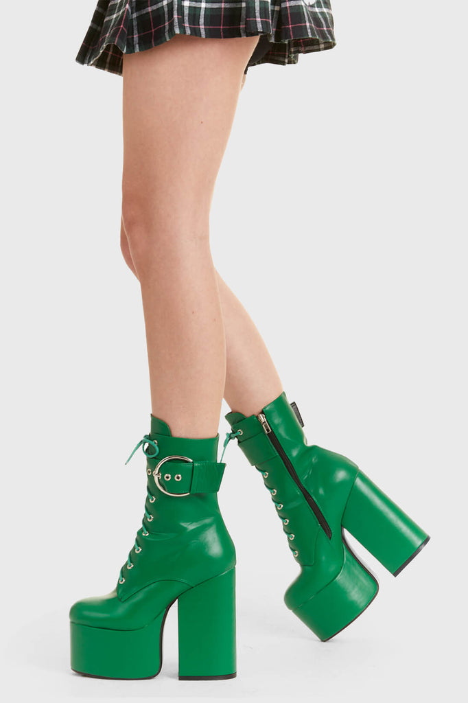 Not Your Basic Boots

One Shot Platform Ankle Boots in Green faux leather. These platform boots feature a lace-up design, with a thick strap around the angle with a silver buckle, perfect to elevate any outfit. Made with eco-friendly materials and 100% cruelty-free, these platform boots are as ethical as they are Perfect!

- Platform Height
- Heel Height
- Green Zipper
- lace-up
- Strap around ankle
- silver buckle and eyelets
- Ankle length
- Platform sole
- High Heel
- 100% vegan 

SKU: LMF 2848 - GreenPU