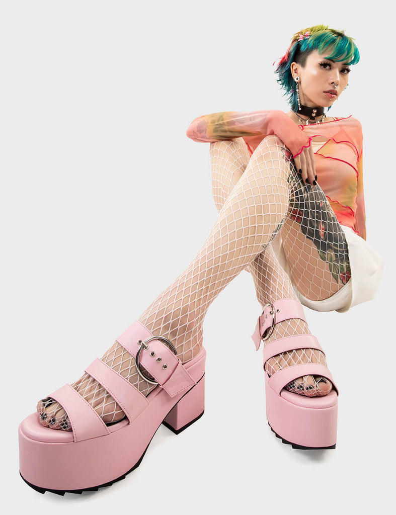 Tropical Twist
 
 Out The Mud Chunky Platform Sandals in pink faux leather. These platform sandals feature two straps across the upper with a adjustable strap, set trends on step at a time. Made with eco-friendly materials and 100% cruelty-free.
 
 - Platform Height
 - Heel Height
 - Two white straps
 - Adjustable pink strap
 - Silver eyelets with D shaped buckle
 - Chunky Platform sole
 - Shark's teeth grip
 - Round Toe 
 - 100% vegan 
 
 SKU: LMF 2542 - PinkPU