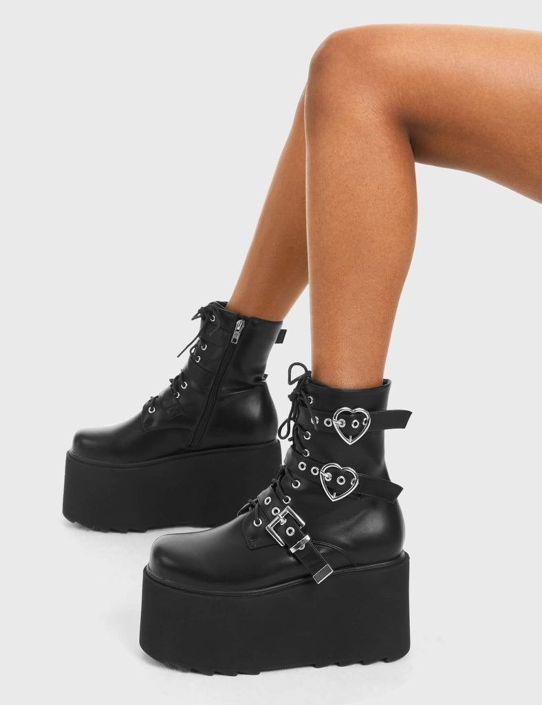 ELEVATED 
 
 Part Time Lover Chunky Platform Ankle Boots in Black Faux Leather. These vegan western Boots feature a two heart buckles and one square buckle with a chunky platform, very edgy. Made with eco-friendly materials and 100% cruelty-free, these boots are as ethical as they are Chic!
 
  
 - Chunky Platform
 - Ankle length
 - Two Heart Buckles
 - Square buckle Buckles
 - Adjustable straps
 - Two Heart Buckles
 - Rounded toe 
 - 100% vegan 
 
 SKU: LMF 3749 - BlackPU