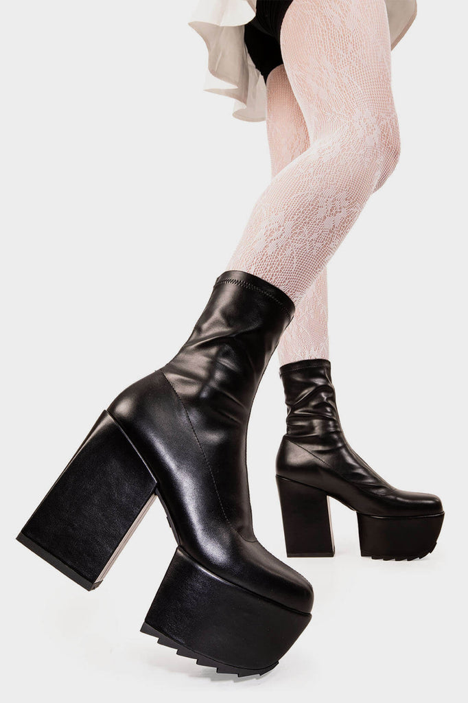 Mini Diva's
 
 Pretty Please Platform Ankle Boots in Black faux leather. These black vegan Platform Boots feature on our platform sole, where height meets attitude. Made with eco-friendly materials and 100% cruelty-free, these platform boots are as ethical as they are sassy!
 
 
 - Platform Height: 2 inch
 - Heel Height: 4.8 inch
 - Black zipper 
 - Platform sole
 - Round Toe
 - 100% vegan 
 
 SKU: LMF 1951 - BlackPU