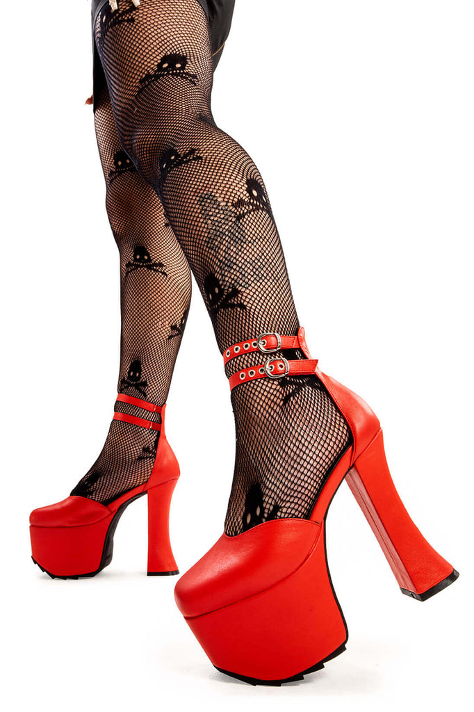 Making them Stare!
 
 Pursuit Platform Heels in Red faux leather. These platform heels feature two ankle straps with buckles, on our platform sole and curved heel. Made with eco-friendly materials and 100% cruelty-free, these platform boots are as ethical as they are Trendy.
 
 - Platform Height
 - Heel Height
 - Thin ankle straps
 - Silver buckle and eyelets
 - Curved Heel
 - Platform Sole
 - 100% vegan 
 
 SKU: LMF 2982 - RedPU