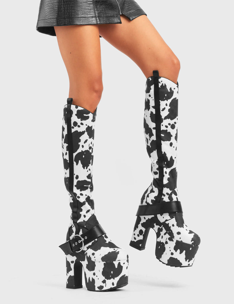 ANIMALISTIC

Rhinestone Cowboy Chunky Platform Knee High Boots in Cow Print faux suede. These vegan Platform Boots feature an ICONIC western cow print on a Chunky Platform sole and heel, also features a adjustable strap across the front. Made with eco-friendly materials and 100% cruelty-free, these boots are as ethical as they are wild!


- Platform Height: 
- Heel Height: 
- Cowprint Design
- Knee High Length 
- Black Zipper
- Platform Sole
- Pointed Toe
- 100% vegan

SKU: LMF 5118 - Cowprint