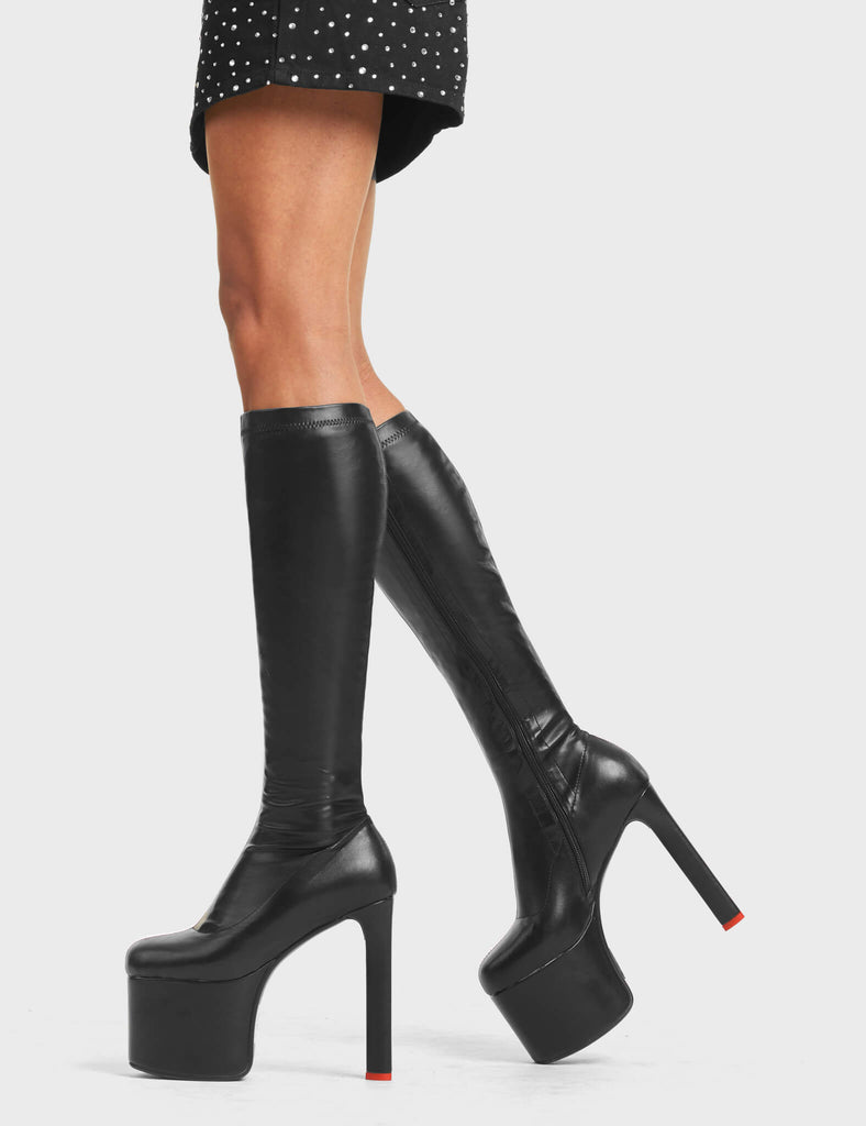 SHOWSTOPPER
 
 Rockstar Girlfriend Platform Knee High Boots in Black faux leather. These platform boots feature a minimalist look with a stretchy construction. Features a heart shaped heel with a red heart at the bottom Made with eco-friendly materials and 100% cruelty-free, these platform boots are as ethical as they are chic.
 
 - Platform Height:
 - Heel Height: 
 - Knee high 
 - Red Heart
 - Heart heel
 - High Heel
 - 100% vegan 
 
 SKU: LMF 4646 - BlackStretchPU