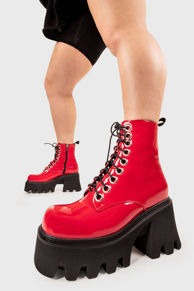 TAKE ON THE WORLD
 
 Run To You Chunky Platform Ankle Boots in Red Patent. These vegan Boots feature a CHUNKY Platform sole and large O shaped eyelets, perfect for adding height and edge to any outfit. Made with eco-friendly materials and 100% cruelty-free, these Boots are as ethical as they are hot!
 
 
 - Platform Height: 3.3 inch
 - Black zipper
 - Lace up
 - O shaped buckle and silver eyelets
 - CHUNKY Platform sole
 - Square toe 
 - 100% vegan 
 
 SKU: LMF 1370 - RedPAT