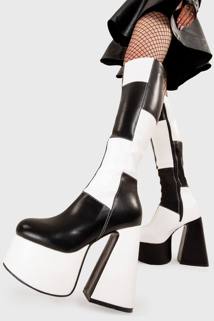 TIME TO DANCE
 
 Runway Wide Calf Platform Knee High Boots in Black and white faux leather. These platform boots feature a black and white patch work design with a triangle heel, keeping it nice and classy. Made with eco-friendly materials and 100% cruelty-free, these platform boots are as ethical as they are chic.
 
 - Platform Height
 - Knee high length
 - Patch work design
 - Wide calf
 - Triangle heel
 - High Heel
 - 100% vegan 
 
 SKU: LMF 3361 - BlackPU/WhitePU - WIDE FIT
