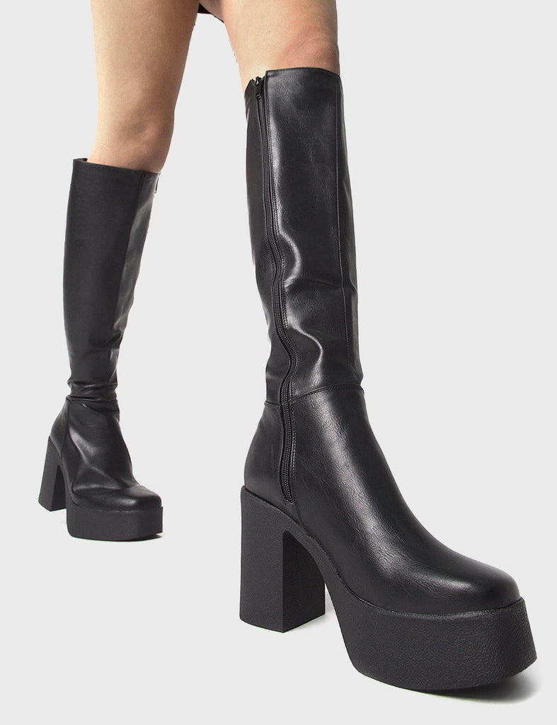 THE TRENDING ONE
 
 Slick Nicks Platform Knee High Boots in Black faux leather. These Black vegan Boots feature an elegant minimalist design and a Platform sole and heel, perfect for adding height and style to any outfit. Made with eco-friendly materials and 100% cruelty-free, these boots are as ethical as they are stylish.
 
 
 - Platform Height: 1.25 inch
 - Heel Height: 4 inch
 - Knee High length
 - Black zipper 
 - Platform sole
 - Square toe 
 - 100% vegan 
 
 SKU: LMF 0856 - BlackPU