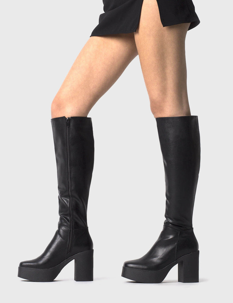 THE TRENDING ONE
 
 Slick Nicks Platform Knee High Boots in Black faux leather. These Black vegan Boots feature an elegant clutter free design and a Platform sole and heel, perfect for adding height and style to any outfit. Made with eco-friendly materials and 100% cruelty-free, these boots are as ethical as they are stylish.
 
 
 - Platform Height: 1.25 inch
 - Heel Height: 4 inch
 - Knee High length
 - Black zipper 
 - Platform sole
 - Square toe 
 - 100% vegan 
 
 SKU: LMF 0856 - BlackPU