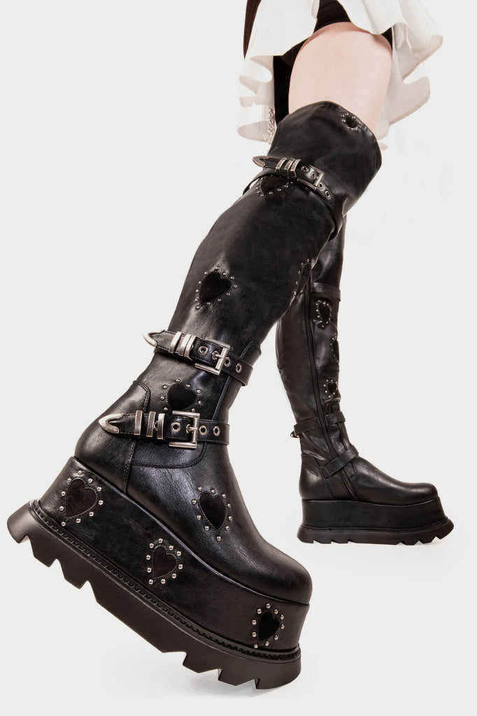 The Rebel 
 
 Sonnet Chunky Platform Thigh High Boots in Black faux leather. These black vegan Platform Boots feature black suede hearts throughout with a perimeter of silver studs and three adjustable straps with square shaped buckles, let your boots do the talking! 
 
 
 - Platform Height
 - Black Zipper
 - Black suede hearts 
 - Silver studs 
 - Adjustable black lace up detail
 - Silver square shaped buckles with silver eyelets 
 - Shark's teeth rubber grip 
 
 SKU: LMF 2078 - Black/BlackHeart