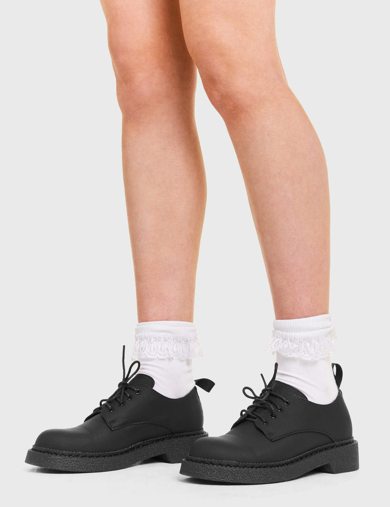 Stay in Skool Shoes in Black. Features include Black Laces.