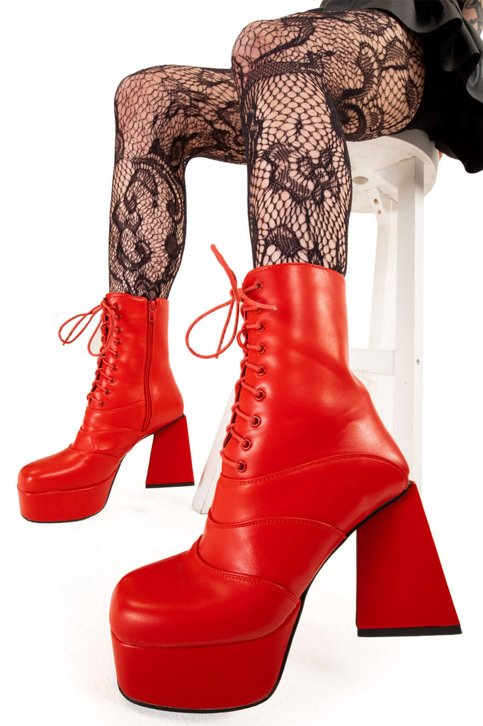 KEEP IT SMOOTH 
 
 Strollin' Platform Ankle Boots in Red faux leather. These platform boots feature a minimalist look with a triangle heel, keeping it nice and classy. Made with eco-friendly materials and 100% cruelty-free, these platform boots are as ethical as they are chic.
 
 - Platform Height
 - Ankle length
 - Lace up
 - Triangle heel
 - High Heel
 - 100% vegan 
 
 SKU: LMF 3331 - RedPU