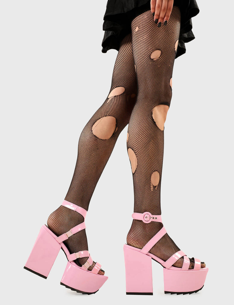 Cutie Pies
 
 Tinted Windows Platform Sandals in Pink Patent faux leather. These platform sandals feature pink straps across the upper and an adjustable ankle strap with silver eyelets, adding cuteness to every step. Made with eco-friendly materials and 100% cruelty-free.
 
 - Platform Height
 - Heel Height
 - Adjustable red strap
 - Shark's teeth grip
 - Silver eyelets with 'O' shaped buckle
 - Chunky Platform sole
 - Square Toe 
 - 100% vegan 
 
 SKU: LMF 2524 - PinkPAT