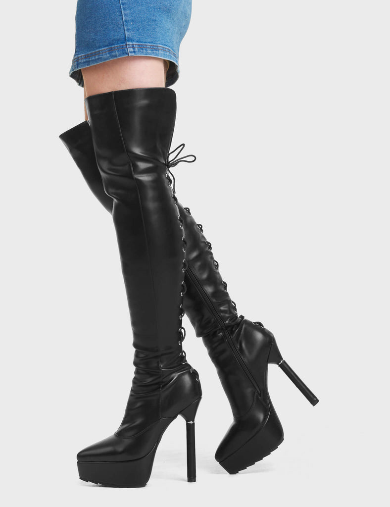 Transmit Platform Thigh High Boots in Black. These feature a lace up design, on a platform sole with silver ring platform heel