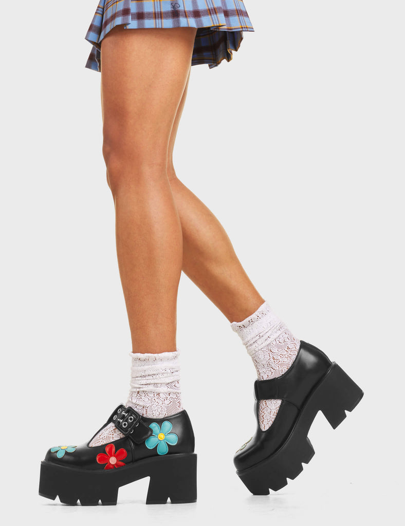 Watch Me Chunky Mary Jane Shoes in Black faux leather. Features multi-coloured flowers, on a chunky and comfortable platform sole.